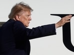 President Donald Trump waves from the stairs of Air Force One upon his departure at Joint Base Andrews, Md., Monday, Oct. 5.(AP Photo/Luis M. Alvarez)