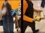The video shows the woman walking out of the store while covering her face.