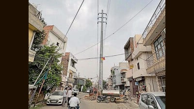 An electricity pole and a transformer installed in the middle of roads in Ludhiana on Monday. (Manish/HT) An electricity pole and a transformer installed in the middle of roads in Ludhiana on Monday. (Manish/HT)