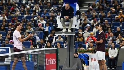 Serbia's Novak Djokovic (R) and Germany's Alexander Zverev argue with the referee during their men's singles quarter-final at the China Open (AFP) Serbia's Novak Djokovic (R) and Germany's Alexander Zverev argue with the referee during their men's singles quarter-final at the China Open (AFP)