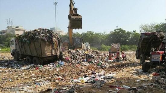 Bhawani Shankar Tripathi, a resident of Sector 23A, said that residents are frustrated with the foul smell reaching their homes from fresh waste being dumped at the site every day. (HT Photo)