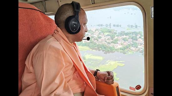 Chief minister Yogi Adityanath conducts an aerial survey of the flood-affected areas due to water level rise in the Gomti, in Lucknow and Sitapur districts on Monday. ((@myogiadityanath X/ANI Photo))