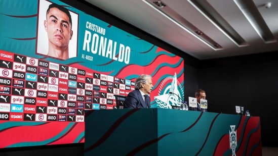 Portugal's coach Jorge Jesus speaks during a press conference to announce the list of players for the next Nations League qualifying matches, with a screen showing Portugal's forward #7 Cristiano Ronaldo on the list of players (AFP)