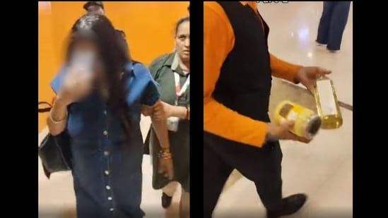 The video shows the woman walking out of the store while covering her face.