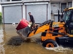 A flood-affected man moves to a safer place by tractor from the flood-affected Faizullaganj area due to flooding in the Gomti River, in Lucknow on Monday. (ANI)