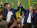 Brazil's President and re-election candidate for the Workers' Party (PT) Luiz Inacio Lula da Silva (R) speaks to supporters accompanied by Vice-President Geraldo Alckmin (L) following the partial results of the presidential election in Sao Paulo, Brazil on October 4, 2026. Brazilian senator Flavio Bolsonaro, son of the far-right former leader Jair Bolsonaro, finished ahead of President Luiz Inacio Lula da Silva in the election on October 4, 2026, which will go to a run-off in three weeks. 