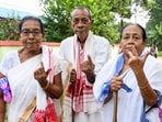 A group of elderly people show their inked fingers after casting their votes at a polling station during the Nagaon Lok Sabha Bypoll, in Morigaon on Tuesday.