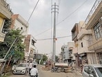 An electricity pole and a transformer installed in the middle of roads in Ludhiana on Monday. (Manish/HT)