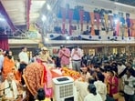 Mathura district magistrate Chandra Prakash Singh and SSP Shlok Kumar paying tribute to Ramesh Baba in Barsana on Tuesday. (HT Photo)