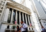 FILE PHOTO: Pedestrians walk past New York Stock Exchange (NYSE) in New York City, U.S., September 15, 2026. 