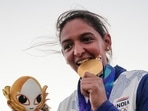 India's captain Harmanpreet Kaur poses for photographs with Gold medal after winning the women's final T20I cricket match between India and Sri Lanka
