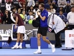Russia's Daniil Medvedev walks off the court after being disqualified from his semi final match against Serbia's Novak Djokovic for hitting a ball into the crowd injuring a spectator