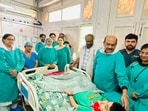 The child’s discharge turned into an emotional moment for the entire PICU staff as his father thanked the doctors and staff and distributed sweets and cut a cake to express his gratitude. (HT Photo) The child’s discharge turned into an emotional moment for the entire PICU staff as his father thanked the doctors and staff and distributed sweets and cut a cake to express his gratitude. (HT Photo)