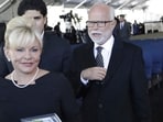Televangelist Jim Bakker, right, walks with his wife Lori Beth Graham. 