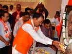 Uttar Pradesh deputy CM Keshav Prasad Maurya paying tribute to VHP leader the late Ashok Singhal in Prayagraj on Oct 6. (HT photo)