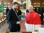 This handout photo taken and released by the Vatican press office, Vatican Media, on October 3, 2026shows Pope Leo XIV (R) exchanging gifts with Montenegro's President Jakov Milatovic