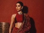 Take cue from Khushi Kapoor who paired a simple halter blouse that kept a heavy saree looking neat and modern