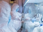 This undated photo released in 2019 by the Irkutsk Anti-Plague Research Institute of Siberia and Far East, shows the institute workers in a lab. (The Irkutsk Anti-Plague Research)