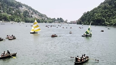 Tourists and devotees take a boat ride at Shree Kainchi Dham - Param Pujya Baba Shri Neeb Karori Maharaj near Bhowali Range, in Nainital on Saturday. (ANI Video Grab) Tourists and devotees take a boat ride at Shree Kainchi Dham - Param Pujya Baba Shri Neeb Karori Maharaj near Bhowali Range, in Nainital on Saturday. (ANI Video Grab)