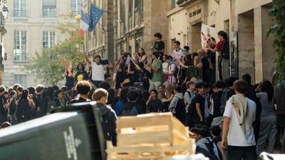 French high school students gather outside the Lycée Sophie Germain high school as part of nationwide protests. (File Photo/Reuters)