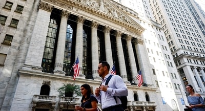 FILE PHOTO: Pedestrians walk past New York Stock Exchange (NYSE) in New York City, U.S., September 15, 2026. 