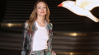 Olivia Wilde also attended the showcase in a co-ord, bejewelled classic Chanel tweed skirt and jacket, completed with a white tee, minimal glam, and Chanel heels. &nbsp; (AP Photo/Thomas Padilla)