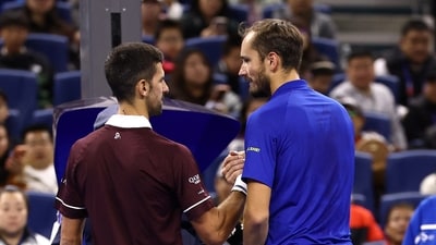 Russia's Daniil Medvedev with Serbia's Novak Djokovic after being disqualified from his semi-final match for hitting a ball into the crowd, injuring a spectator (REUTERS)