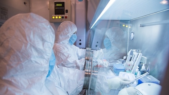 This undated photo released in 2019 by the Irkutsk Anti-Plague Research Institute of Siberia and Far East, shows the institute workers in a lab.