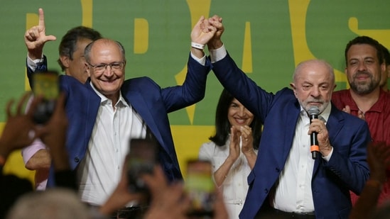 Brazil's President and re-election candidate for the Workers' Party (PT) Luiz Inacio Lula da Silva (R) speaks to supporters accompanied by Vice-President Geraldo Alckmin (L) following the partial results of the presidential election in Sao Paulo, Brazil on October 4, 2026. Brazilian senator Flavio Bolsonaro, son of the far-right former leader Jair Bolsonaro, finished ahead of President Luiz Inacio Lula da Silva in the election on October 4, 2026, which will go to a run-off in three weeks.
