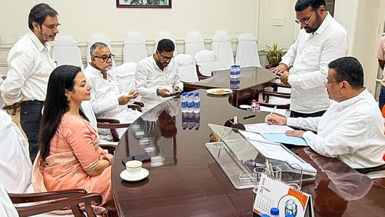 West Bengal Chief Minister Suvendu Adhikari signs documents as BJP candidate Koel Mallick files her nomination for the upcoming Rajya Sabha by-election, in Kolkata on Monday.