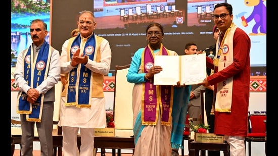 President Droupadi Murmu confers a degree upon a graduate during the first convocation at AIIMS Bilaspur on Tuesday. (HT Photo)