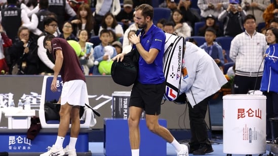 Russia's Daniil Medvedev walks off the court after being disqualified from his semi final match against Serbia's Novak Djokovic for hitting a ball into the crowd injuring a spectator
