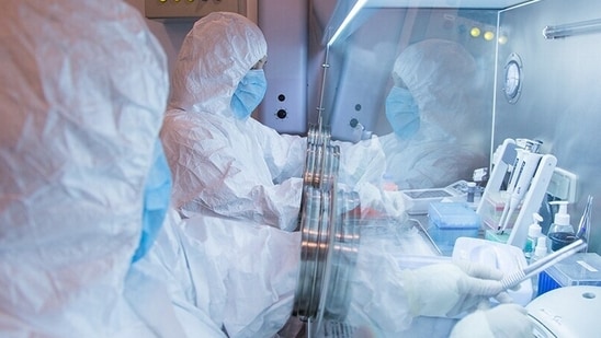 This undated photo released in 2019 by the Irkutsk Anti-Plague Research Institute of Siberia and Far East, shows the institute workers in a lab.