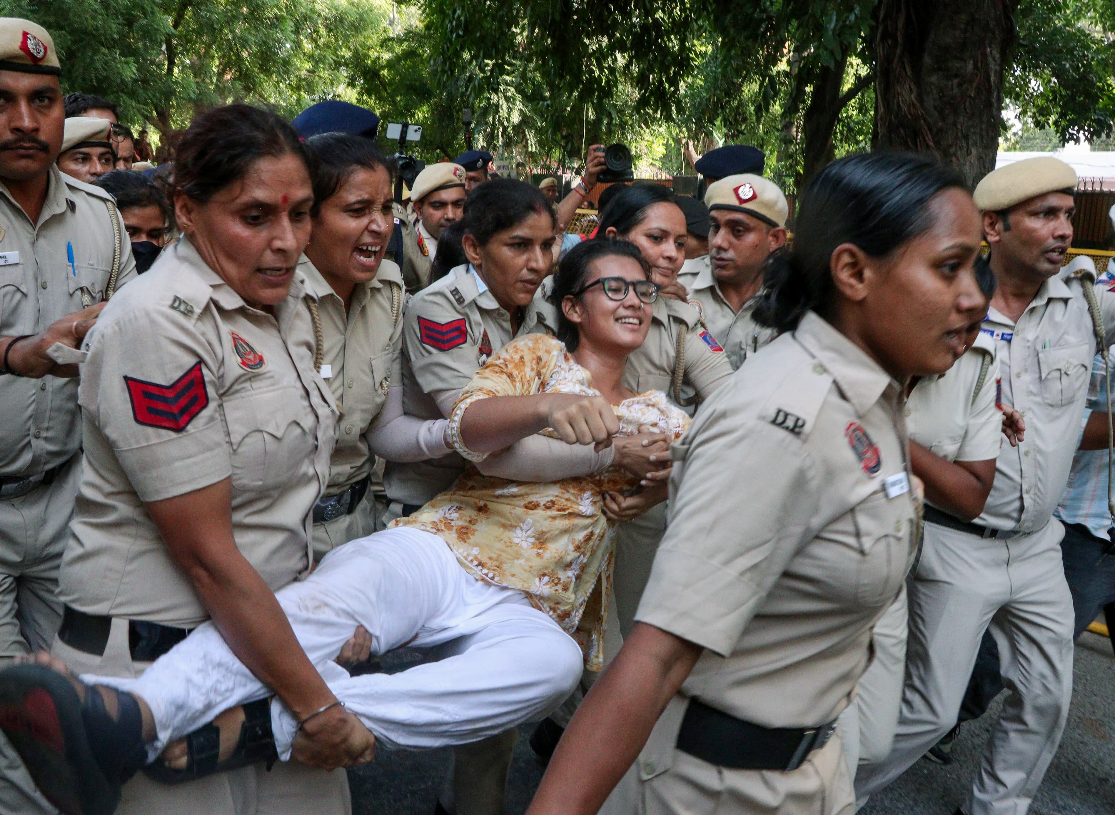 Police personnel detain All India Students' Association (AISA) National President Neha Bora during the ‘Citizens’ March’ from India Gate to Jantar Mantar, in New Delhi on Sunday. (ANI) Police personnel detain All India Students' Association (AISA) National President Neha Bora during the ‘Citizens’ March’ from India Gate to Jantar Mantar, in New Delhi on Sunday. (ANI)