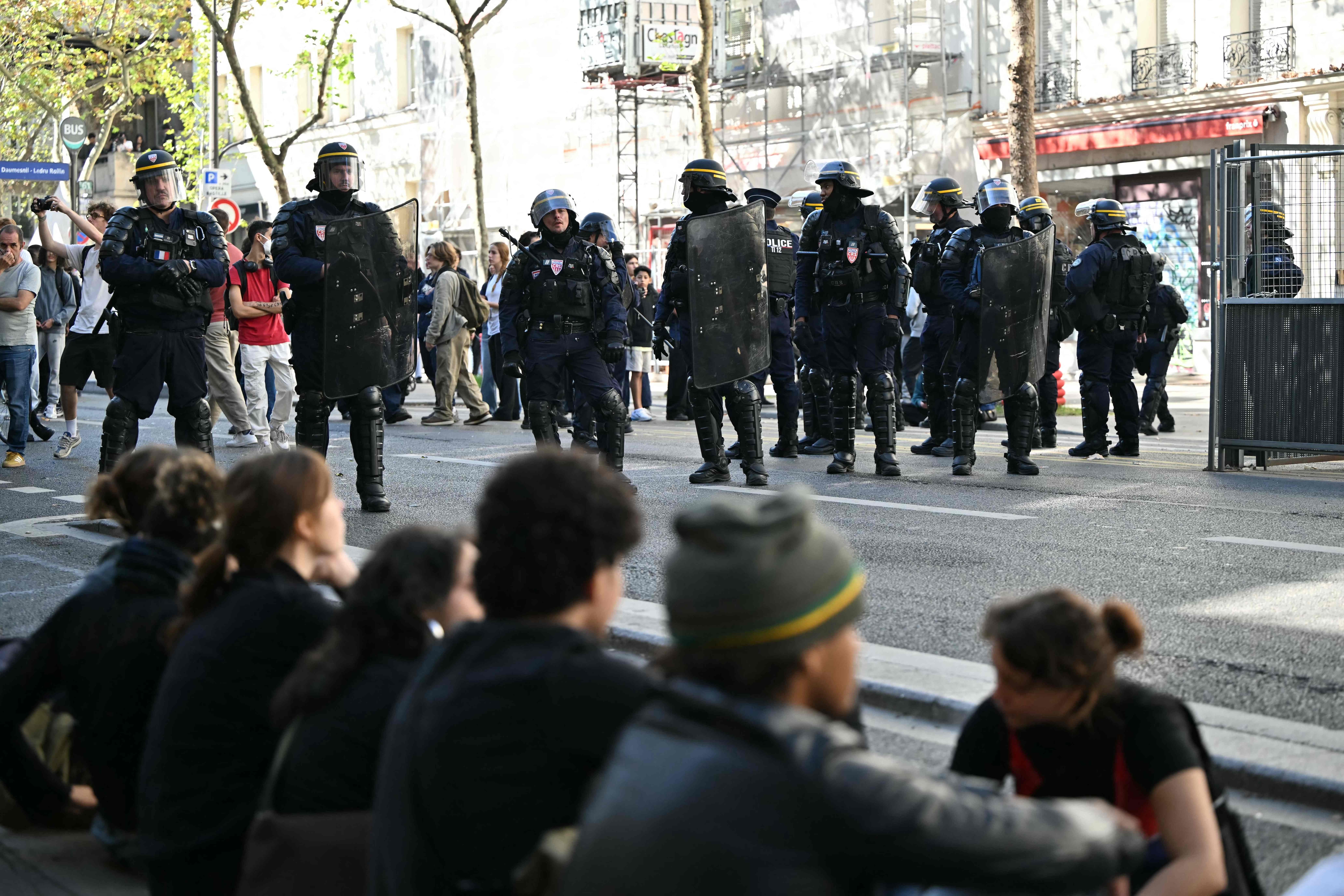 Protesters sit on a street in front of riot police officers on the sidelines of high school students' blockading action near the Place de la Bastille in Paris on October 5, 2026. (File Photo/AFP) Protesters sit on a street in front of riot police officers on the sidelines of high school students' blockading action near the Place de la Bastille in Paris on October 5, 2026. (File Photo/AFP)
