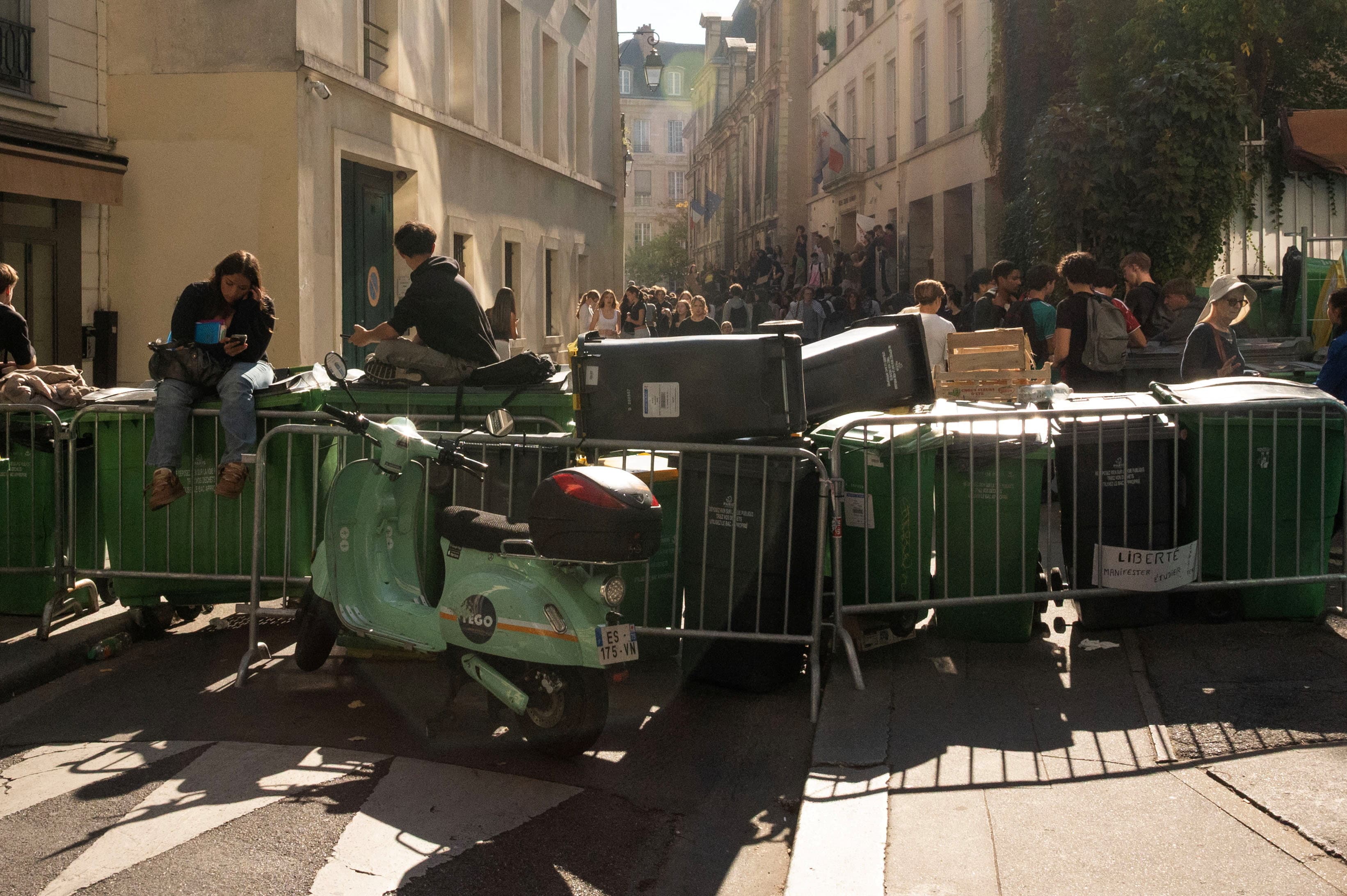 French high school students gather outside the Lycee Sophie Germain high school as part of nationwide protests. (File Photo/Reuters)
