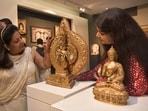 The Buddha is a finely crafted brass sculpture, presented to the Prime Minister by the Governor of Sikkim. The second piece is a tabletop prayer wheel, or Mani Khorlo
