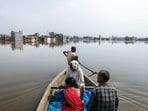 Local boatmen and rescue teams transport stranded residents to safety from the flood-affected Faizullaganj area due to flooding in the Gomti River.(Naeem Ansari)