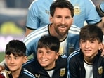 Argentina football legend Lionel Messi poses for a photo with his sons Ciro, Mateo and Thiago ahead of his farewell international friendly against Benin in Buenos Aires on Tuesday. (AFP)