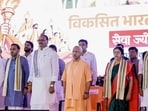 Chief minister Yogi Adityanath, deputy chief minister Brajesh Pathak and others during the ‘Seva Jyoti Yatra - Viksit Bharat Sankalp Sabha’ event in Lucknow on Wednesday. (ANI PHOTO)