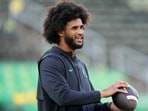 Dante Moore was throwing passes during the session.(Getty Images via AFP)