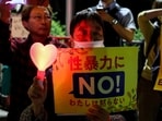 A demonstrator holds a placard during a protest outside the Prime Minister's office following the killing of a Japanese woman in Okinawa, for which a US Marine is a suspect, in Tokyo, Japan. (REUTERS)