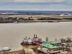 The Mid-Barataria Sediment Diversion project aimed to restore Louisiana's coastline by reconnecting the Mississippi River to the Barataria Basin. Despite initial progress, including permits and funding, it was terminated in July 2025 due to cost and legal concerns. The state is now focusing on alternative restoration efforts.