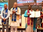President Droupadi Murmu confers a degree upon a graduate during the first convocation at AIIMS Bilaspur on Tuesday. (HT Photo)