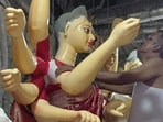 The traditional idols strictly adhere to the scriptural rules regarding the Goddess’ posture, facial expressions, colour, weapons and ten ar