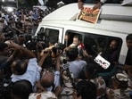 Delhi Police personnel detain LOP Rahul Gandhi at Windsor roundabout in New Delhi during the protest.