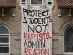 A banner hangs outside a student residence at Cornell.