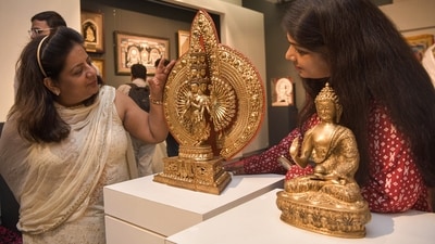 The Buddha is a finely crafted brass sculpture, presented to the Prime Minister by the Governor of Sikkim. The second piece is a tabletop prayer wheel, or Mani Khorlo (ANI) The Buddha is a finely crafted brass sculpture, presented to the Prime Minister by the Governor of Sikkim. The second piece is a tabletop prayer wheel, or Mani Khorlo (ANI)