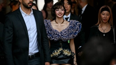 Thai singer and actor Lalisa Manobal was also seen at the Louis Vuitton Women's Spring/Summer 2027 collection fashion show. She wore a statement blouse with voluminous ruffles on the neckline and hem, and a corseted bodice. A black leather mini skirt and gold jewellery rounded off her look. (AFP) Thai singer and actor Lalisa Manobal was also seen at the Louis Vuitton Women's Spring/Summer 2027 collection fashion show. She wore a statement blouse with voluminous ruffles on the neckline and hem, and a corseted bodice. A black leather mini skirt and gold jewellery rounded off her look. (AFP)