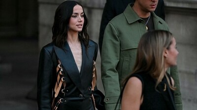 Cuban-Spanish actor Ana De Armas picked a black blazer dress with tan-coloured statement belt details to attend the Louis Vuitton Women's Spring/Summer 2027 collection fashion show. (AFP) Cuban-Spanish actor Ana De Armas picked a black blazer dress with tan-coloured statement belt details to attend the Louis Vuitton Women's Spring/Summer 2027 collection fashion show. (AFP)